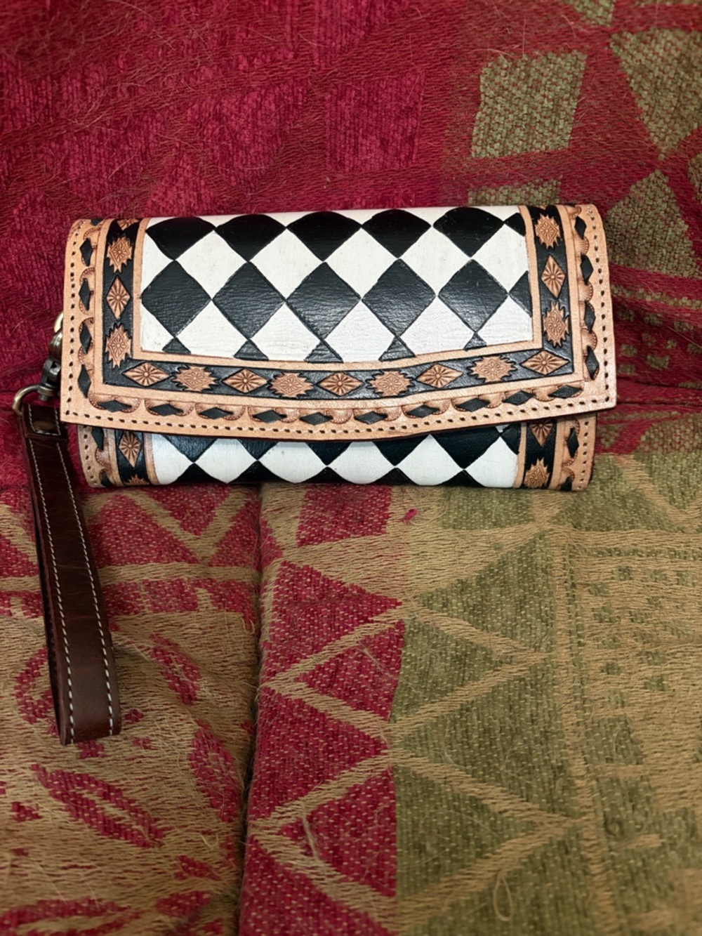 Western style leather brownwallet. Hand painted with snap closure and wristlet.